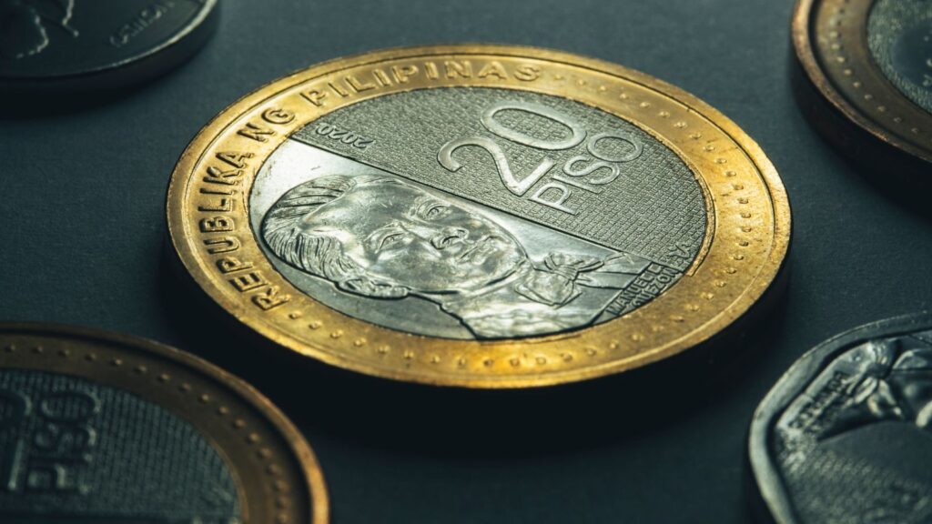Detailed shot of a 20 peso coin from the Philippines highlighting its design.